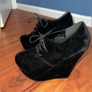 Pair of black suede, wedged shoes, never worn